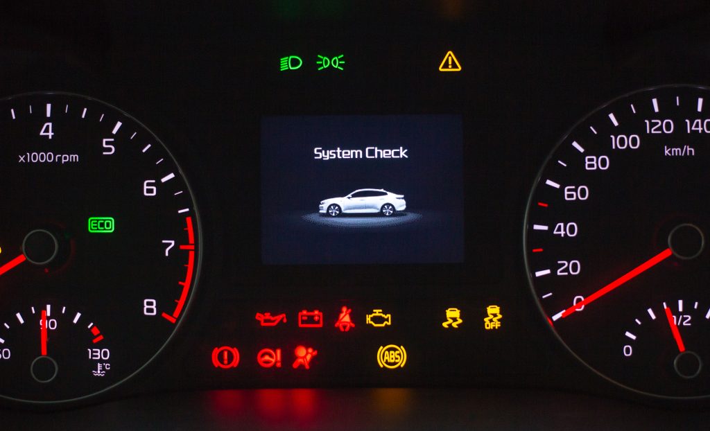 An image of a car dashboard with all of the dashboard warning lights illuminated.